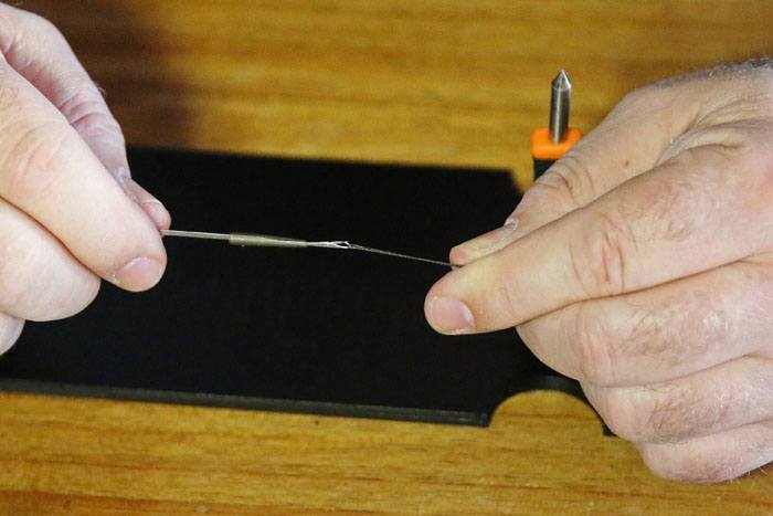 15. Schuif een Short Anti-Tangle Sleeve op een baitlip boilienaald.